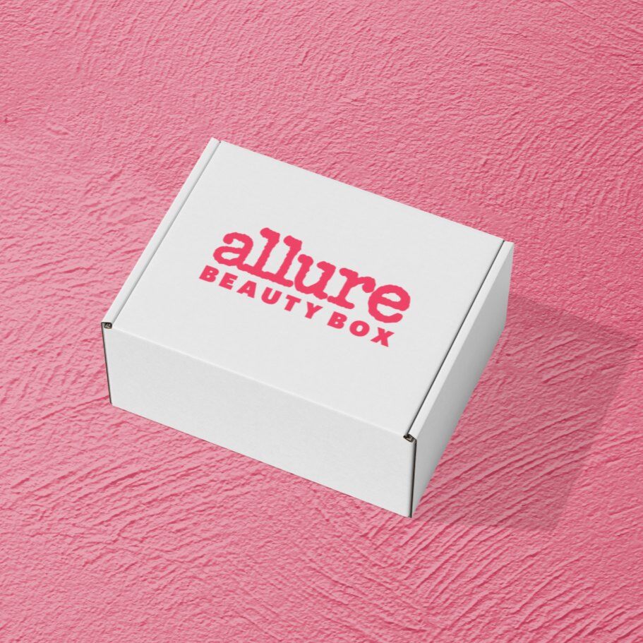 White Allure Beauty Box shipping box with the pink Allure logo on a pink background