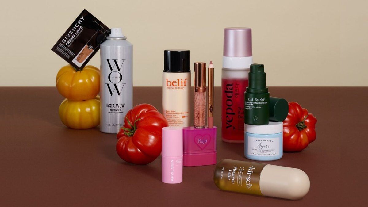The October 2026 Allure Beauty Box products, including Color Wow dry shampoo, Belif, Yepoda, Kaja, Kat Burki, Earth Harbor, Charlotte Tilbury and Kitsch, among tomatoes and squash