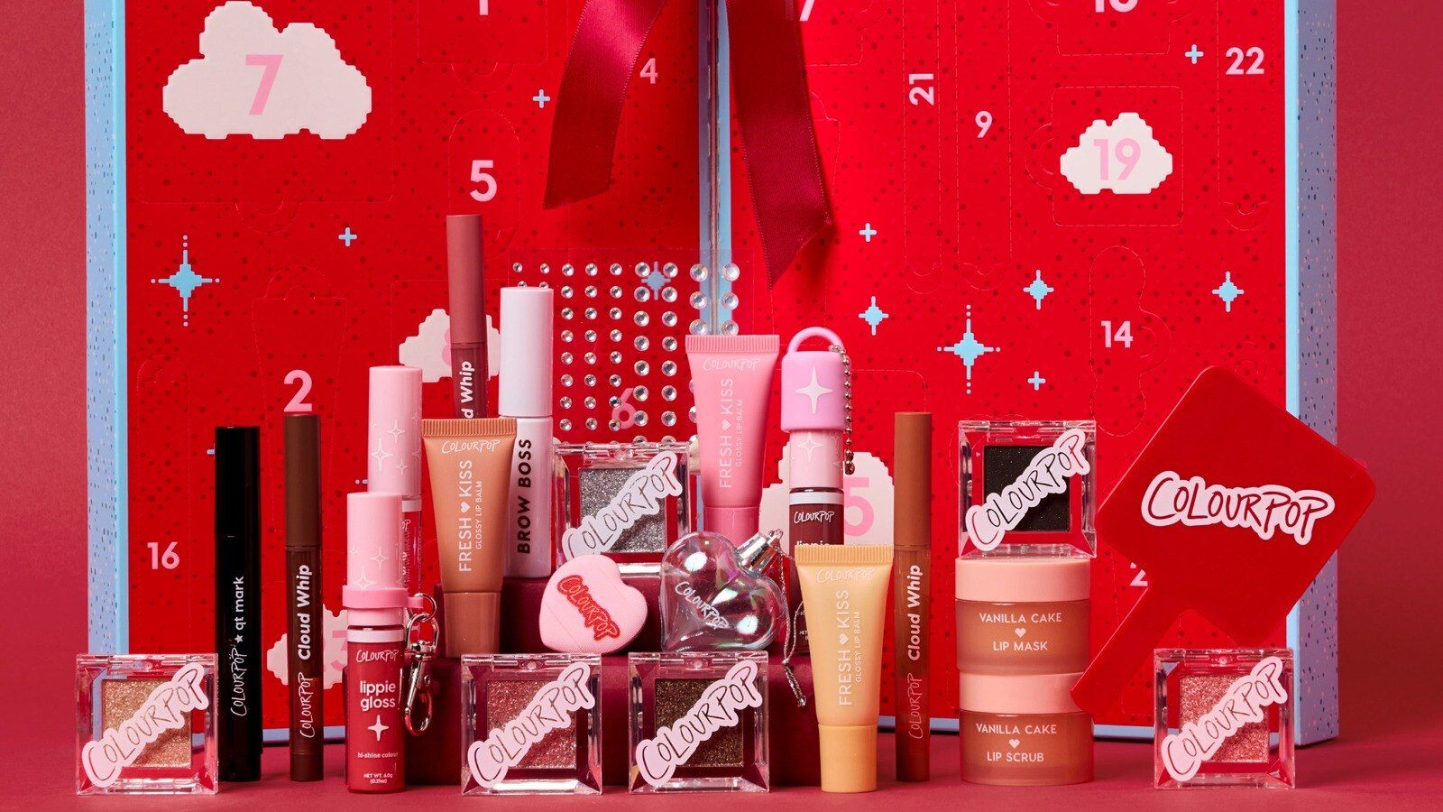 ColourPop Colour Me Merry advent calendar open with lip glosses, liners and pressed shades in front
