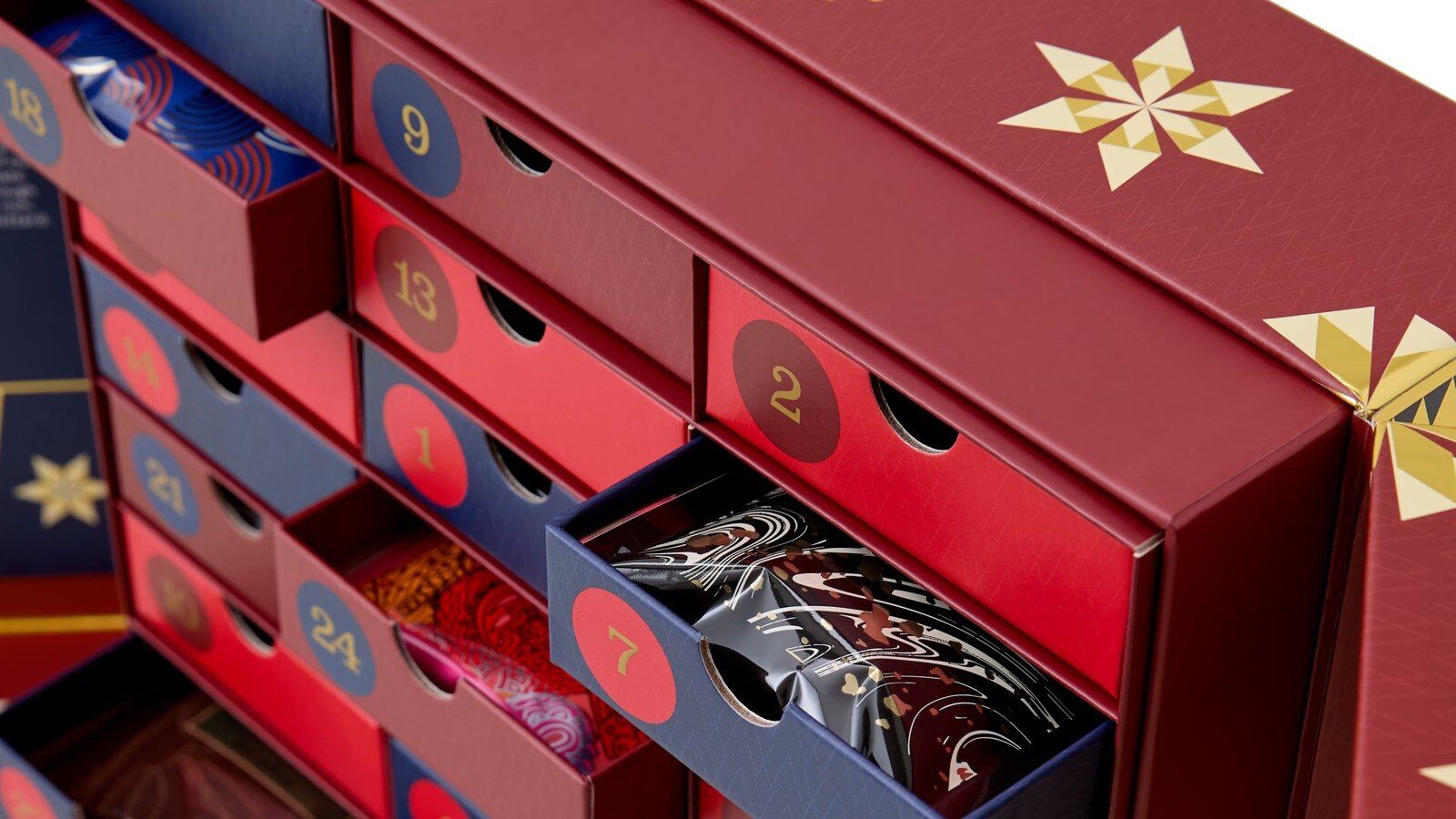 Whittard Hot Chocolate Advent Calendar with open numbered drawers holding hot chocolate sachets