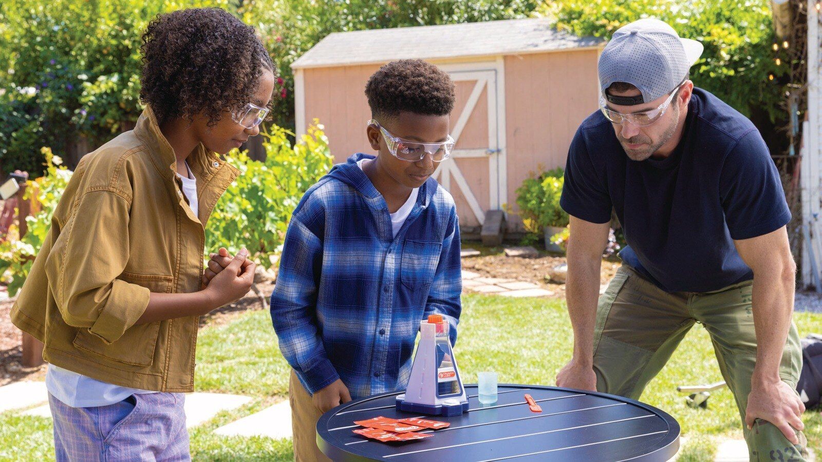 Kids and an adult testing the CrunchLabs Elephant Toothpaste Blast outdoors