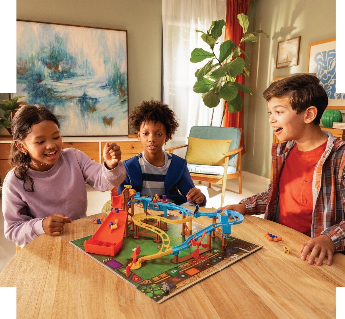 Kids playing the CrunchLabs Squirrel Dash chain reaction game
