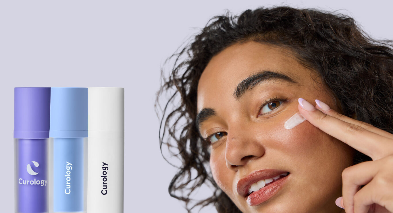 Woman using Curology skincare products