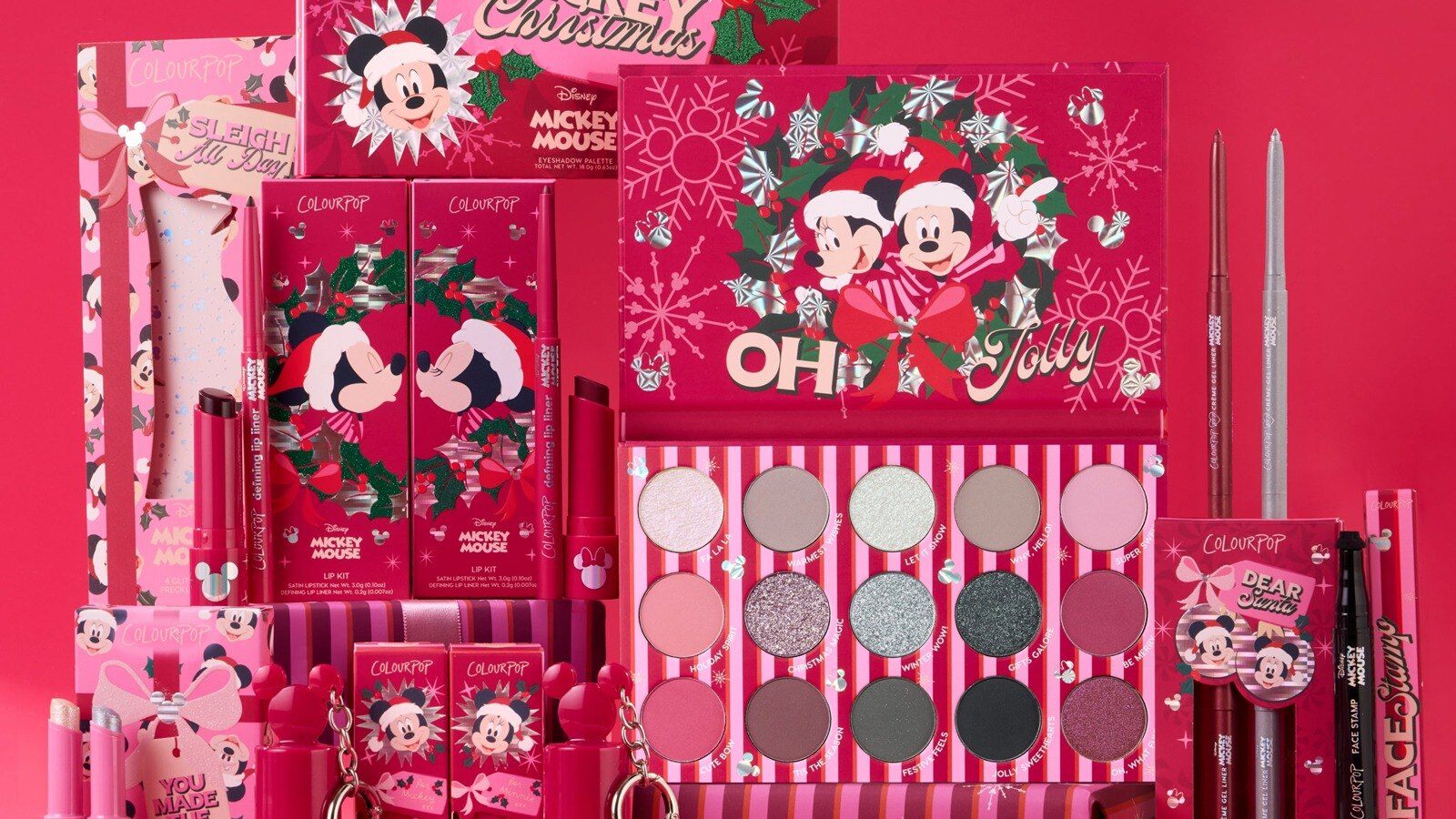 The Disney A Very Mickey Christmas x ColourPop collection boxes, palette and lip kits on a red backdrop