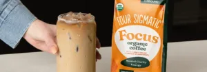 Iced Four Sigmatic Focus mushroom coffee latte on a bright kitchen counter