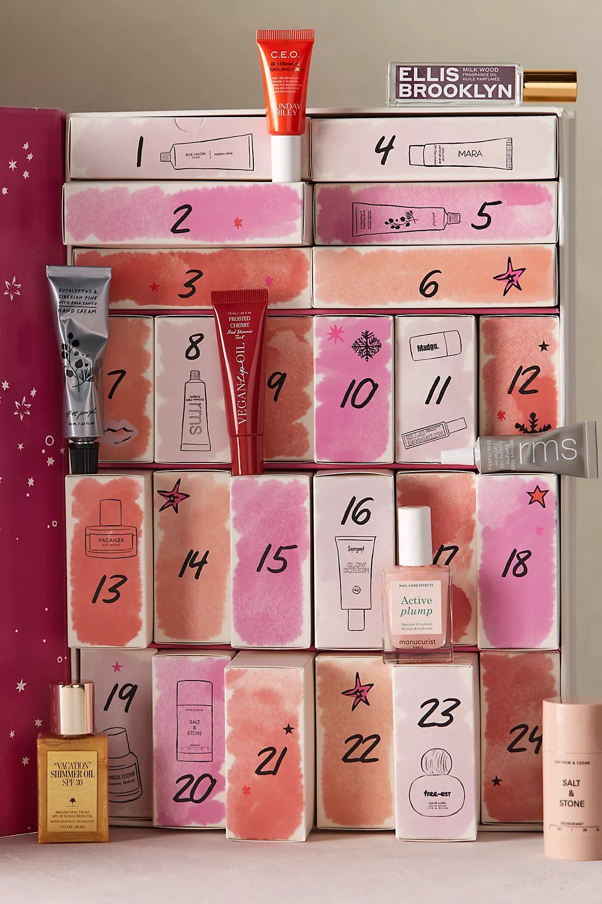 The Free People Curated Beauty Advent Calendar 2026 opened to show its pink numbered doors, with Ellis Brooklyn, Rahua and other mini products