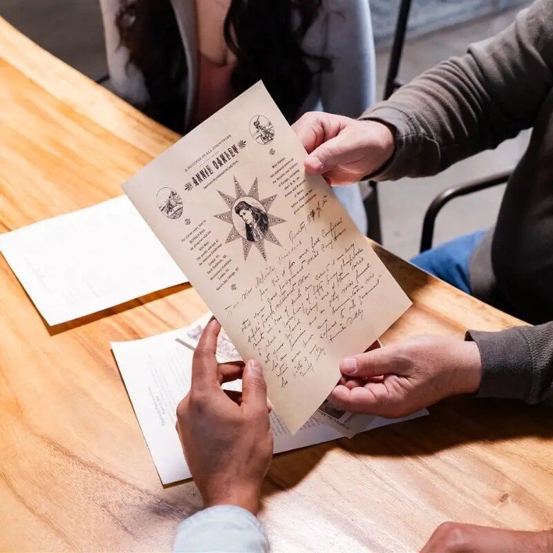 Hands holding a replica historical letter