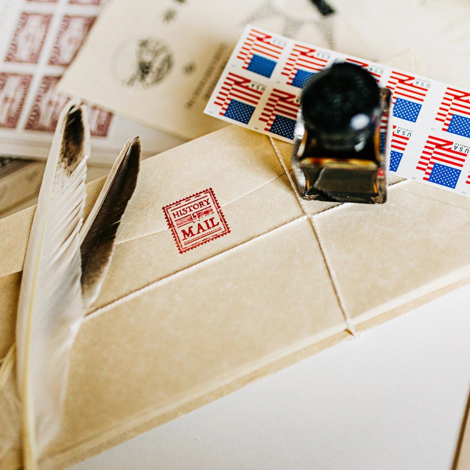 History By Mail letters and envelopes on a desk