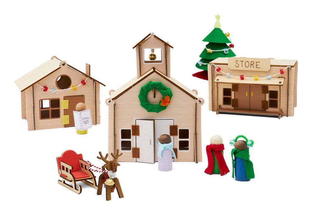 Finished KiwiCo Christmas Village Advent Calendar with wooden houses, sleigh and tree