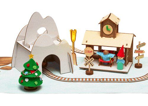 Finished KiwiCo Santa's Railroad Advent Calendar scene with train, station and tree