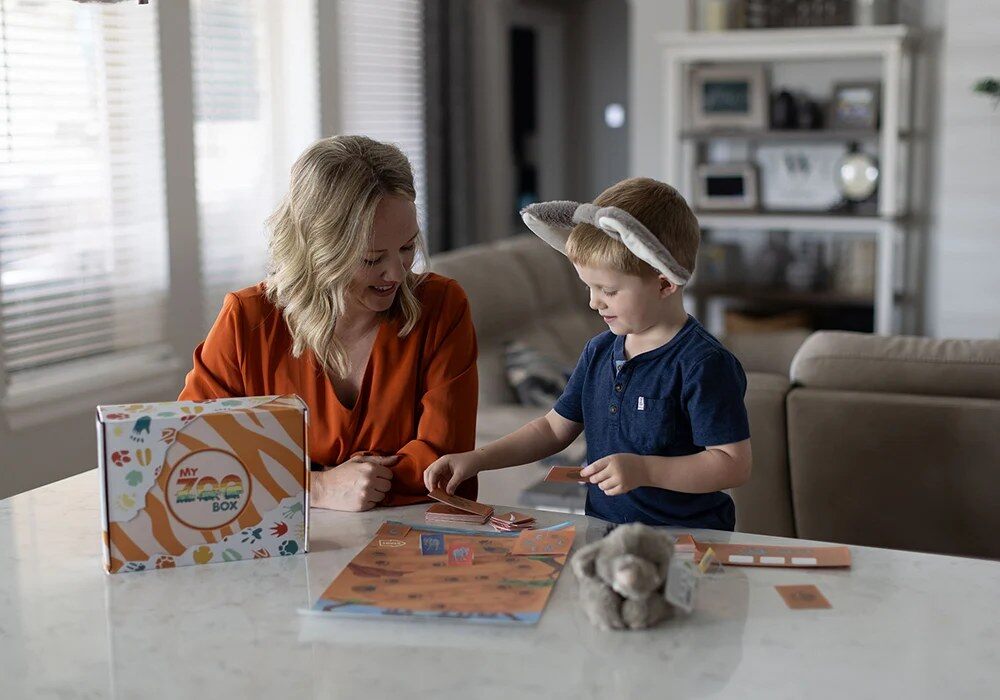 Mother and son doing a My ZOO Box activity together