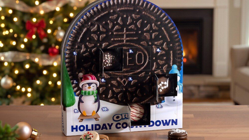 Oreo Holiday Advent Calendar shaped like a giant Oreo cookie in front of a Christmas tree