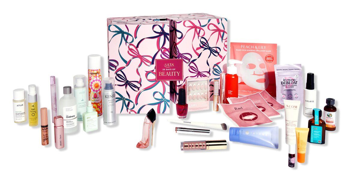 The Ulta 25 Days of Beauty Advent Calendar 2026, a pink box with a ribbon print, surrounded by its products from amika, The Ordinary, OPI, Peach & Lily and Moroccanoil