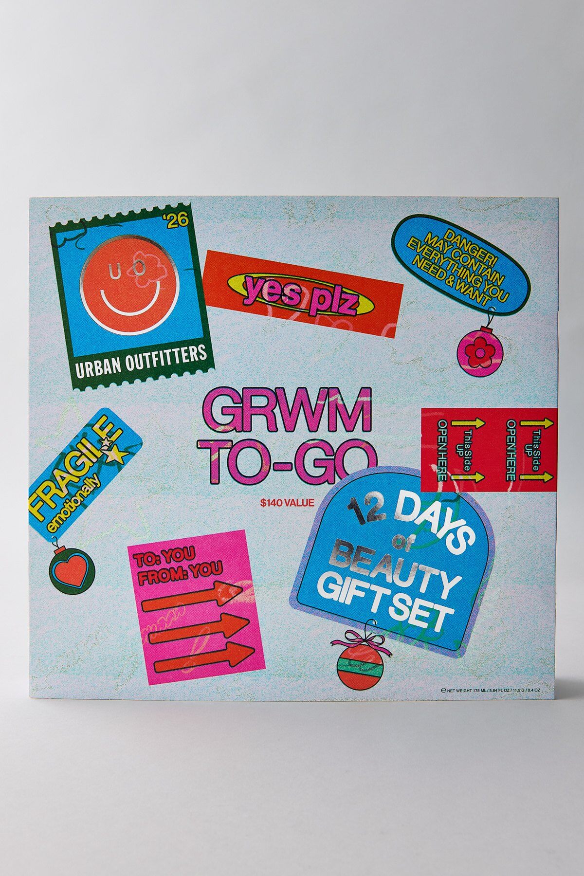 The Urban Outfitters 12 Days of Beauty Advent Calendar 2026, a light blue box covered in colorful stickers reading GRWM To-Go and $140 value